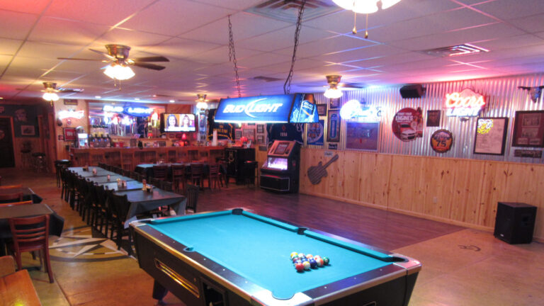 Pool table and dining room at The Boot Jack at Rockin H